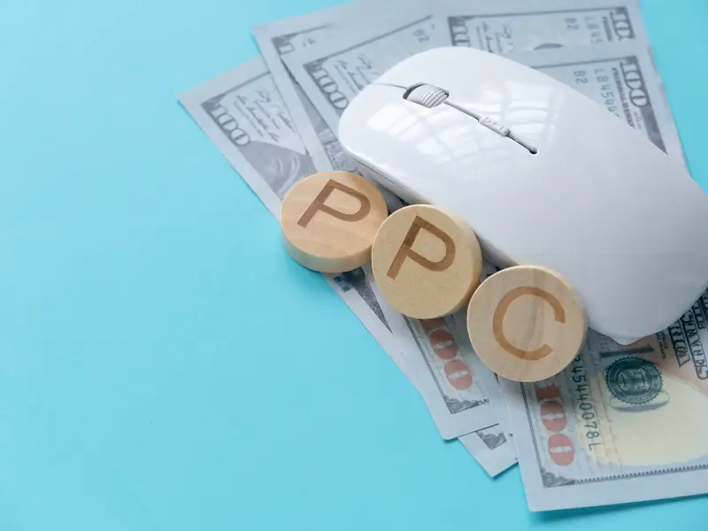 money with a mouse on top and the word PPC