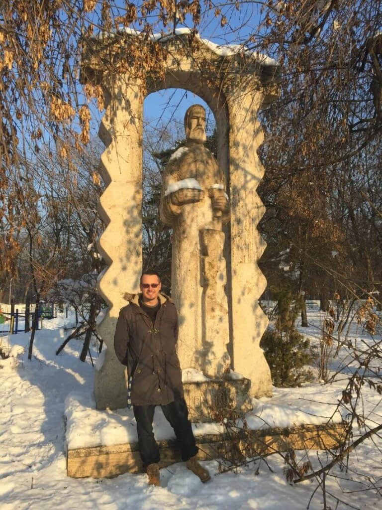 Emanuel P in front of Brancusi statue in Herastrau Park Bucharest Romania
